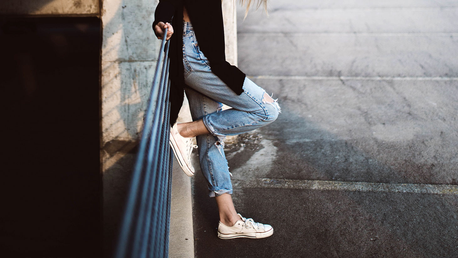 Person Standing with Foot on Rail Person Standing with Foot on Rail
